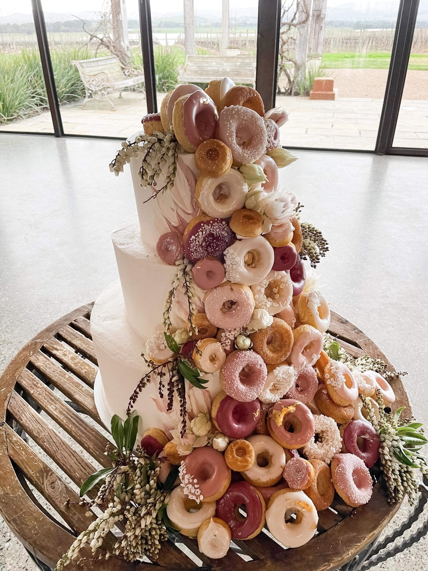 3 Tier Buttercream with Cascading Donuts